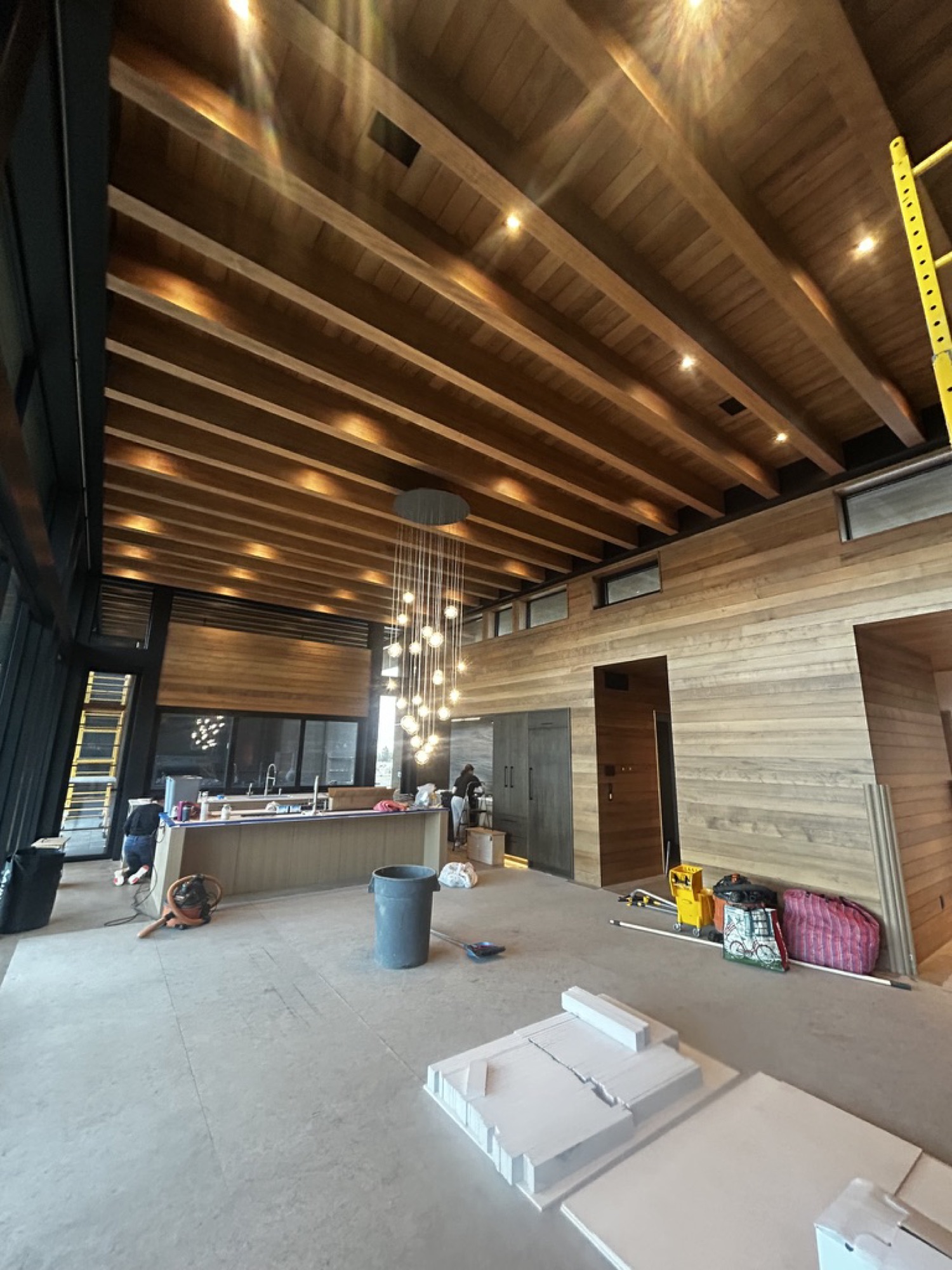 Kitchen with warm tongue-and-groove wood ceiling and pendant lighting